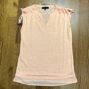 Sleeveless Sanctuary top. Very flattering!